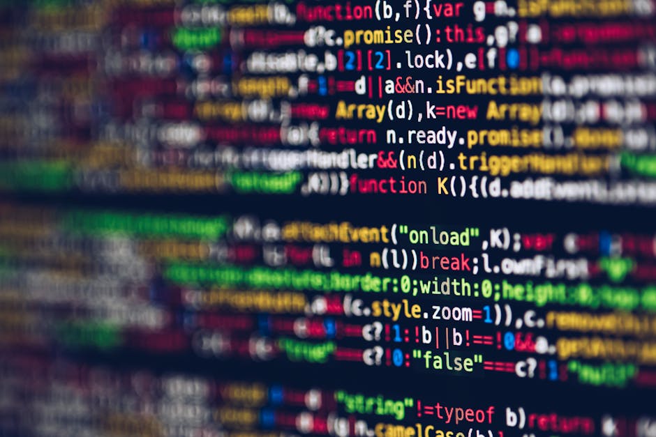 A close-up view of a computer screen displaying colorful lines of code in syntax-highlighted text, including keywords, variables, functions, and symbols, with a blurred background. The code features v
