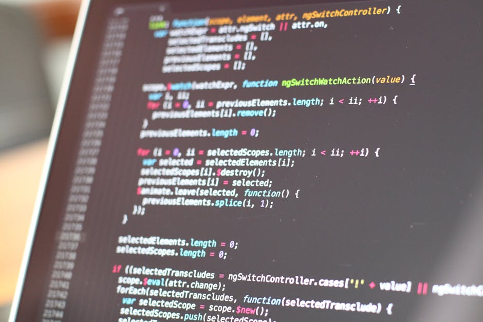 A close-up view of a computer screen displaying lines of colorful programming code with syntax highlighting in various shades of blue, pink, green, and yellow. The code appears to be JavaScript, featu